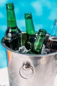 close-up-view-of-ice-bucket-with-beer-standing-nex-2024-11-19-13-23-36-utc-19g6hmf2svbtj.jpg